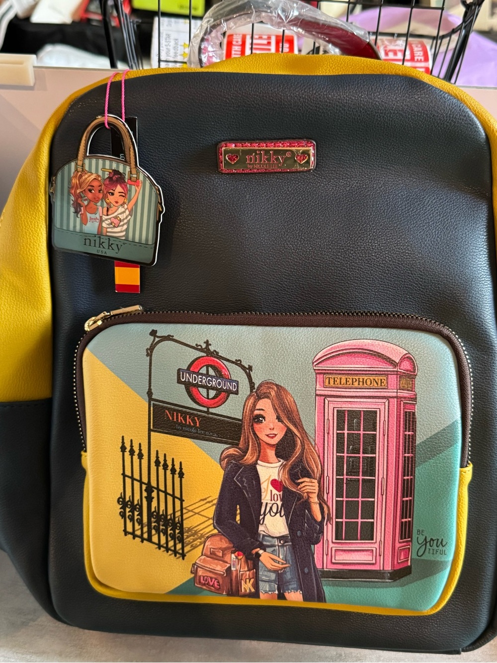 Nicole Lee Black and Yellow Women's Backpack with London Illustration